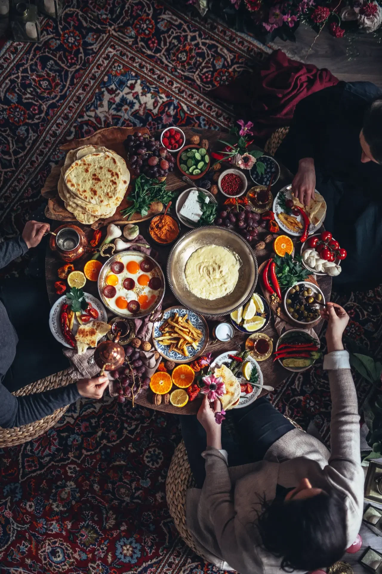 Colorful Turkish sofra feast with dips, vegetables, flatbreads and seasonal garnishes