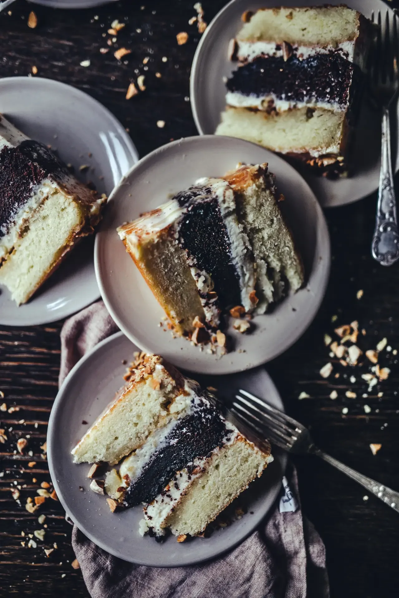Slices of tahini cake showing soft layers and cream filling