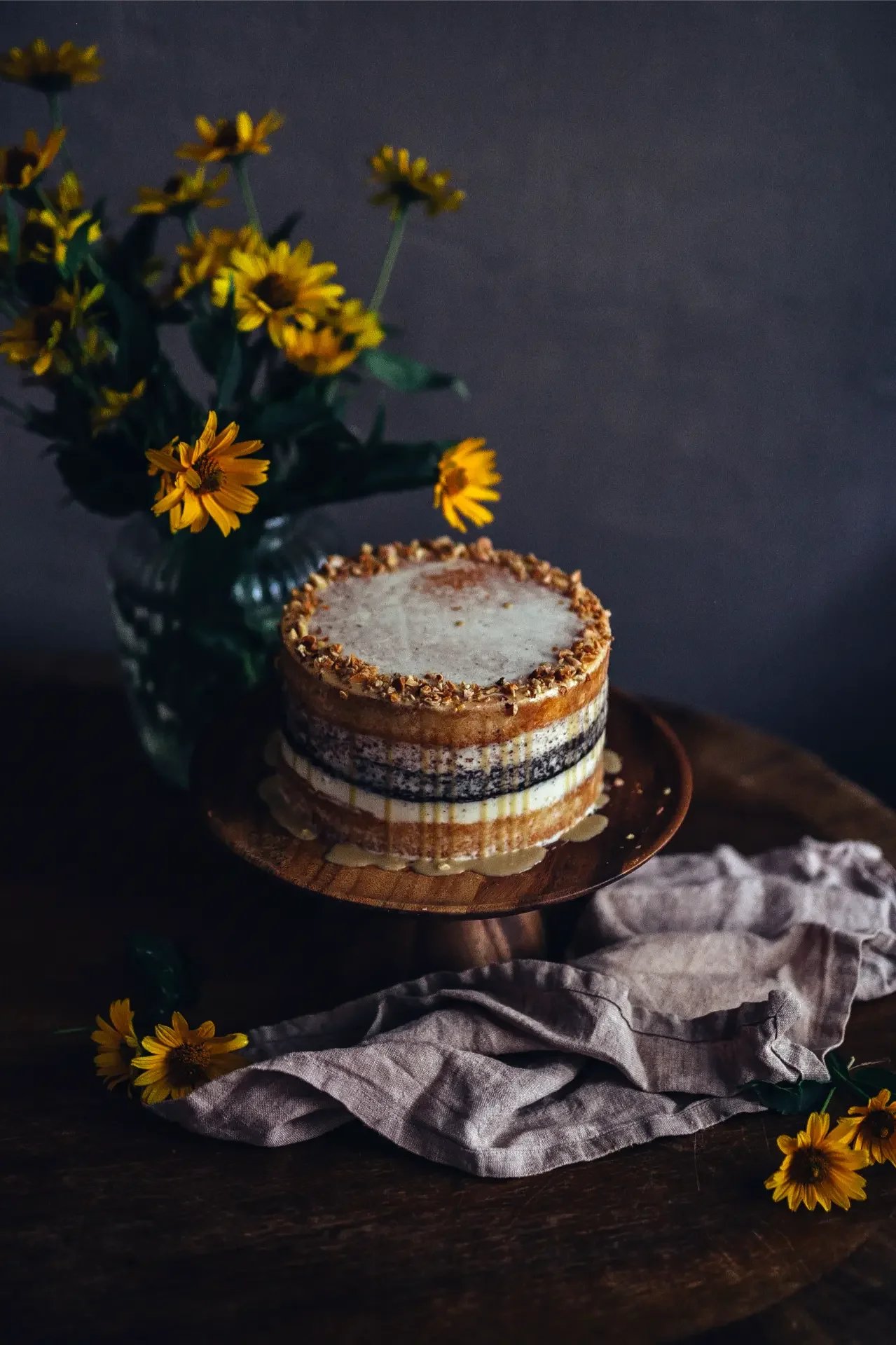 Handcrafted tahini cake decorated with cream and toasted sesame topping