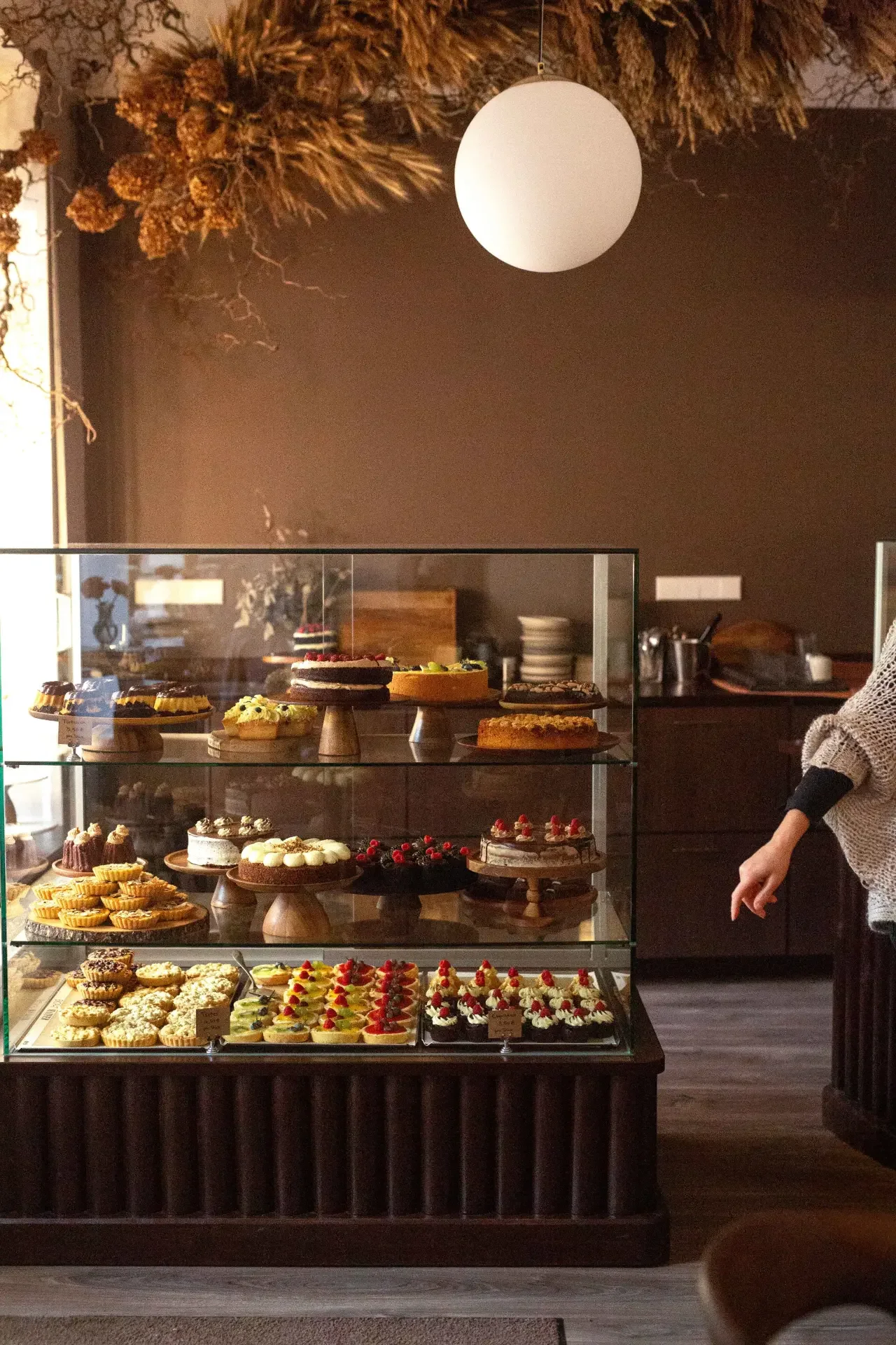 Elegant pastry display inside Dilekerei café in Berlin with artisan cakes and desserts