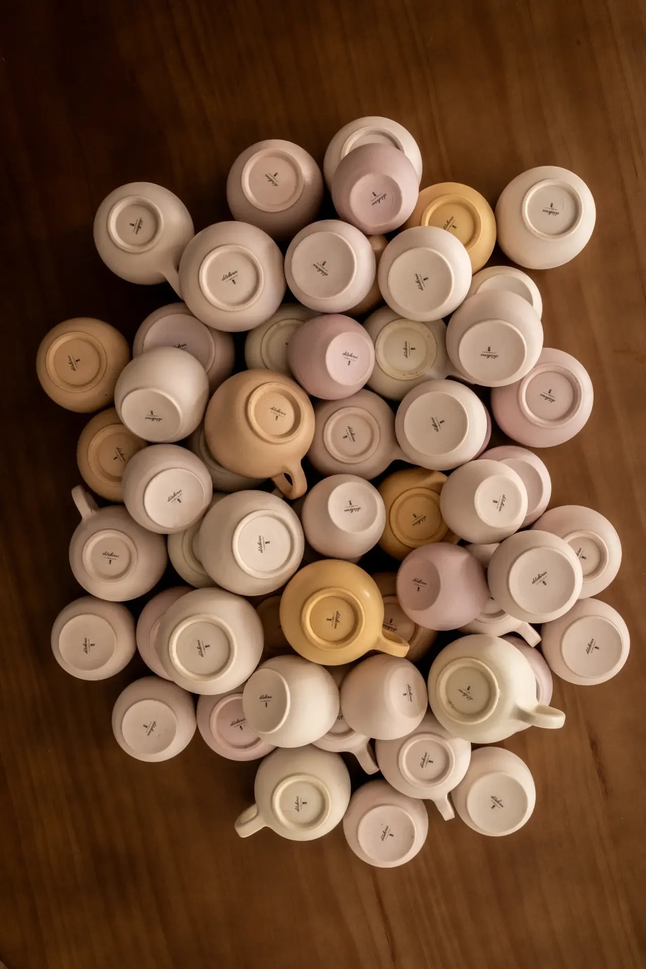 Collection of handcrafted cups arranged in artistic composition