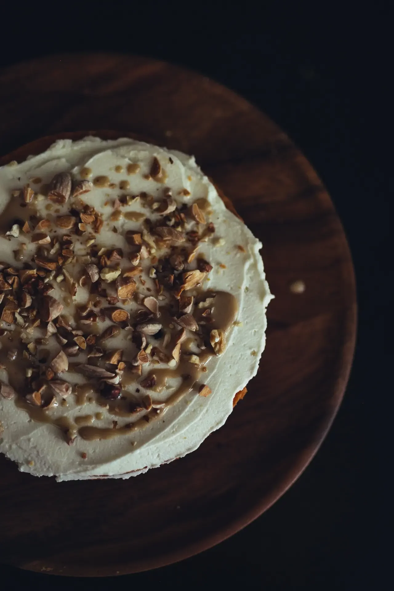 Close-up of tahini cake with toasted nuts decoration