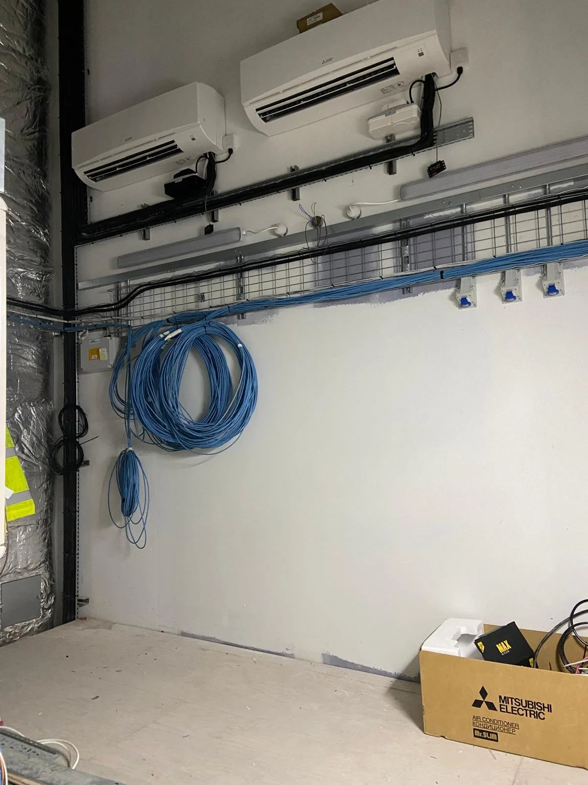 Twin wall mounted AC systems