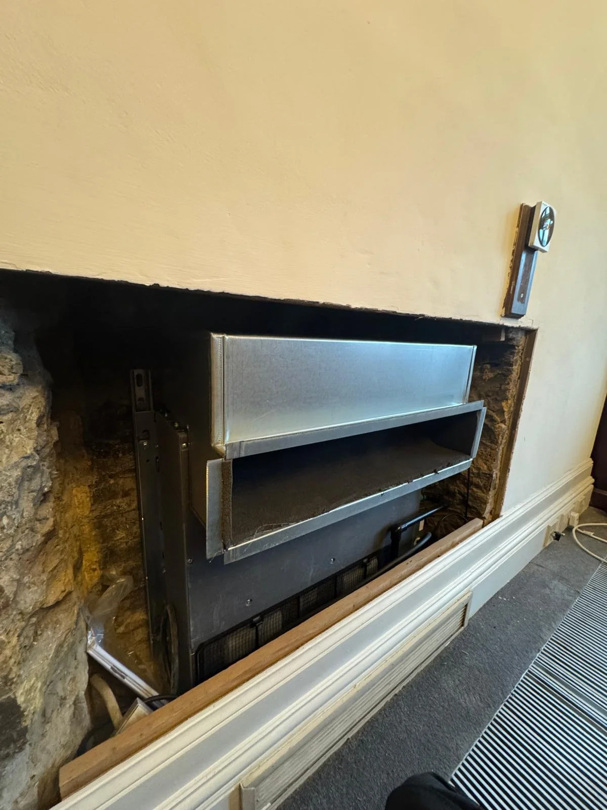 A bespoke floor mounted air conditioning project, installed with ducting and grilles