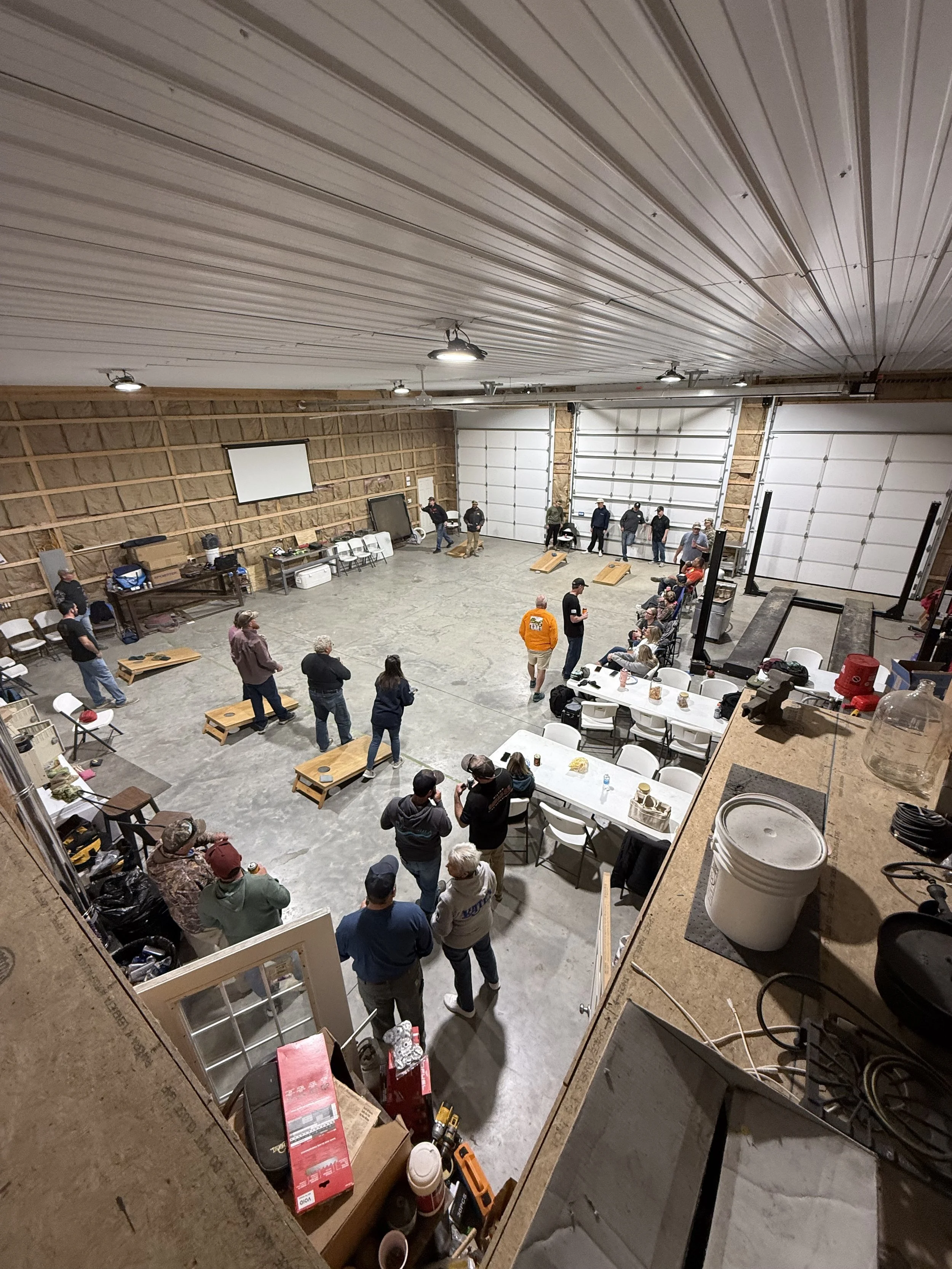Corn hole tournament in the shop at Locklear Farm