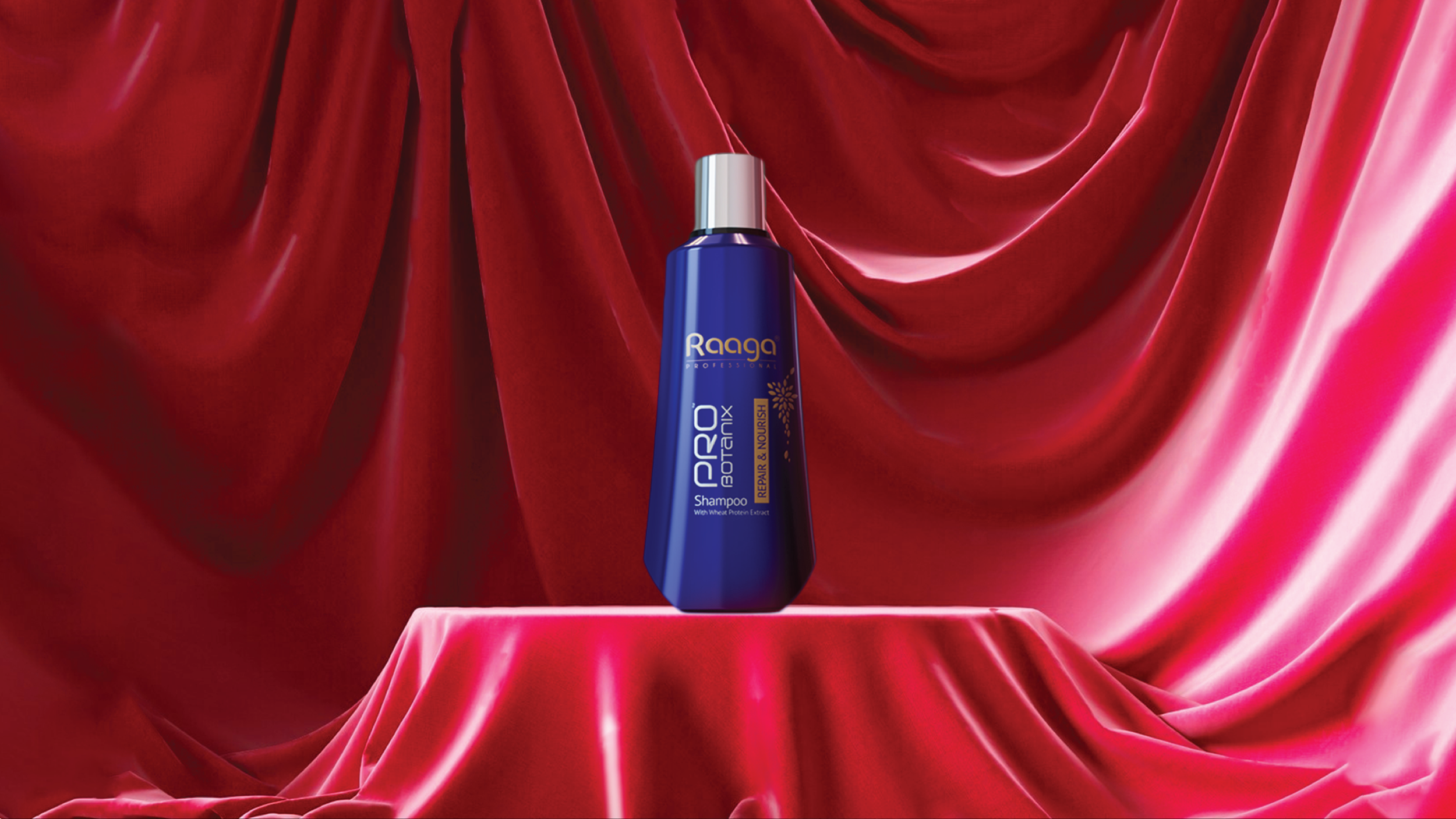A blue bottle of Raaga Pro Shampoo placed on a red velvet cloth with a red velvet curtain backdrop.