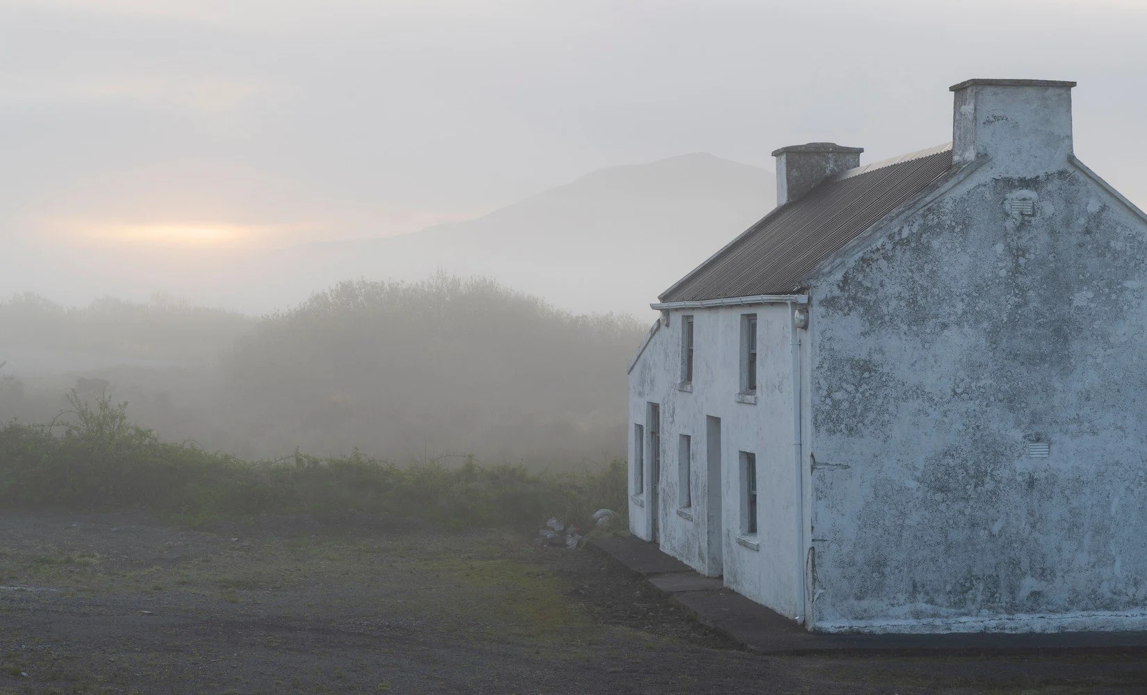 Misty cottage at dawn, County Mayo