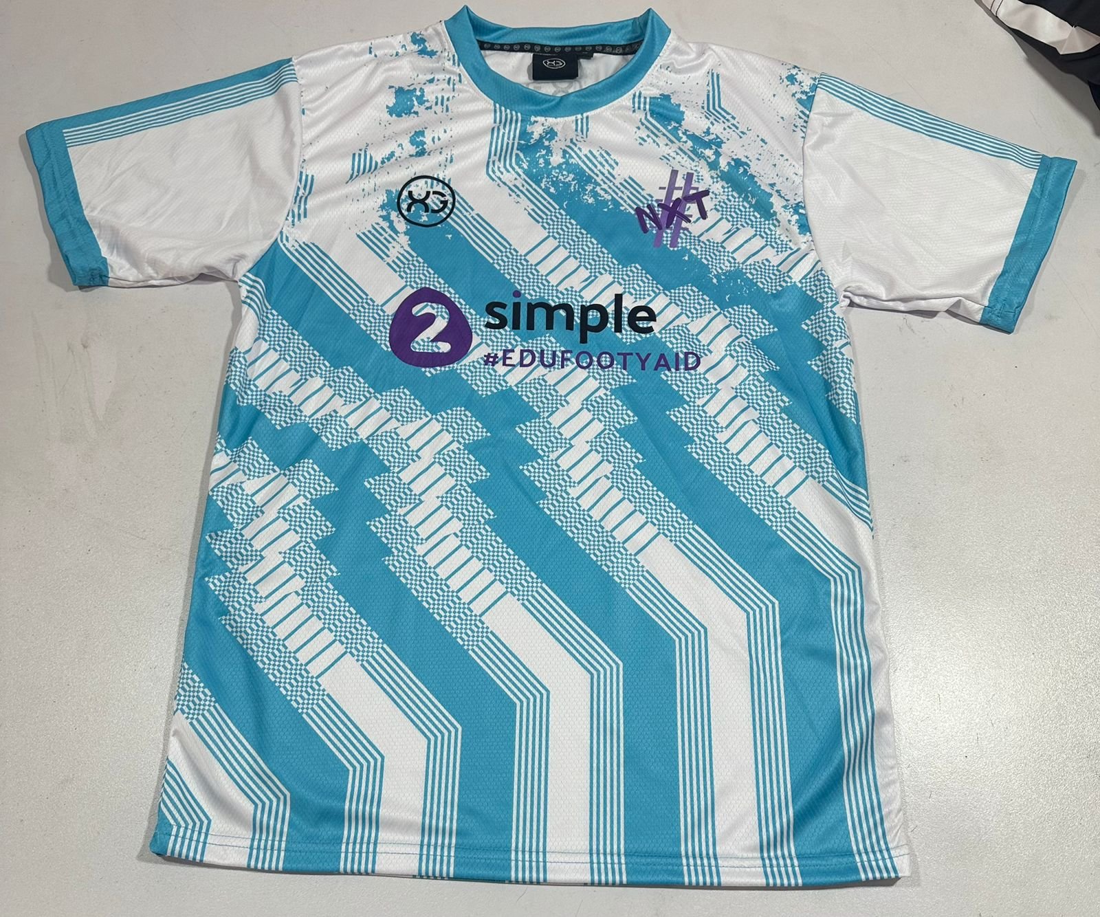 EDU FOOTY AID SHIRT WHITE.jpeg