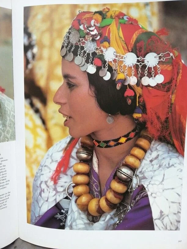 Amber and coins speak wealth on this Berber girl of Morocco.jpeg