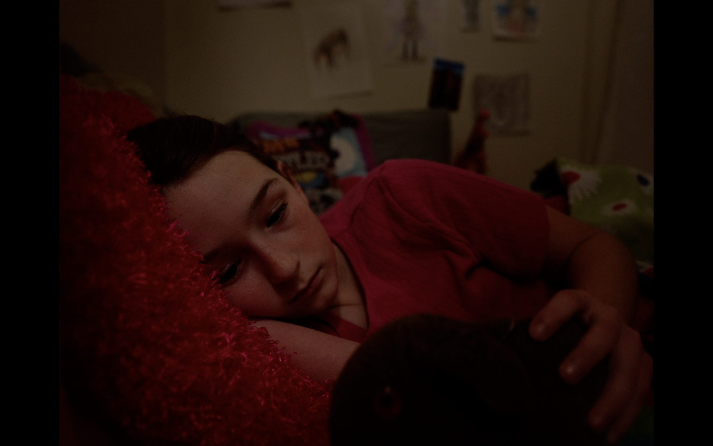YOUNGER DAISY is laying in bed unable to sleep, she tosses and turns until something catches the corner of her eye. 