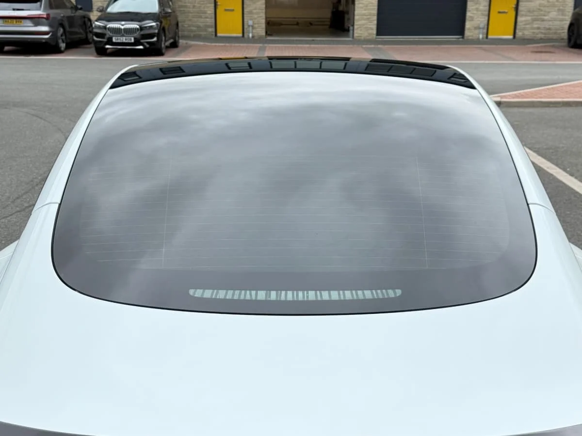 Tesla Model 3 rear view after SunTek Carbon XP limo black window tints fitted by Lucid PPF Leeds
