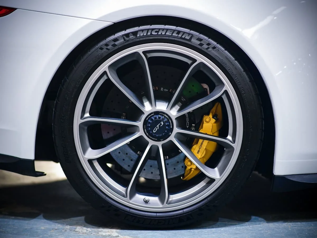 Rear wheel of Porsche 991 GT3 with Gtechniq C5 ceramic coating and yellow Porsche caliper at Lucid PPF Leeds