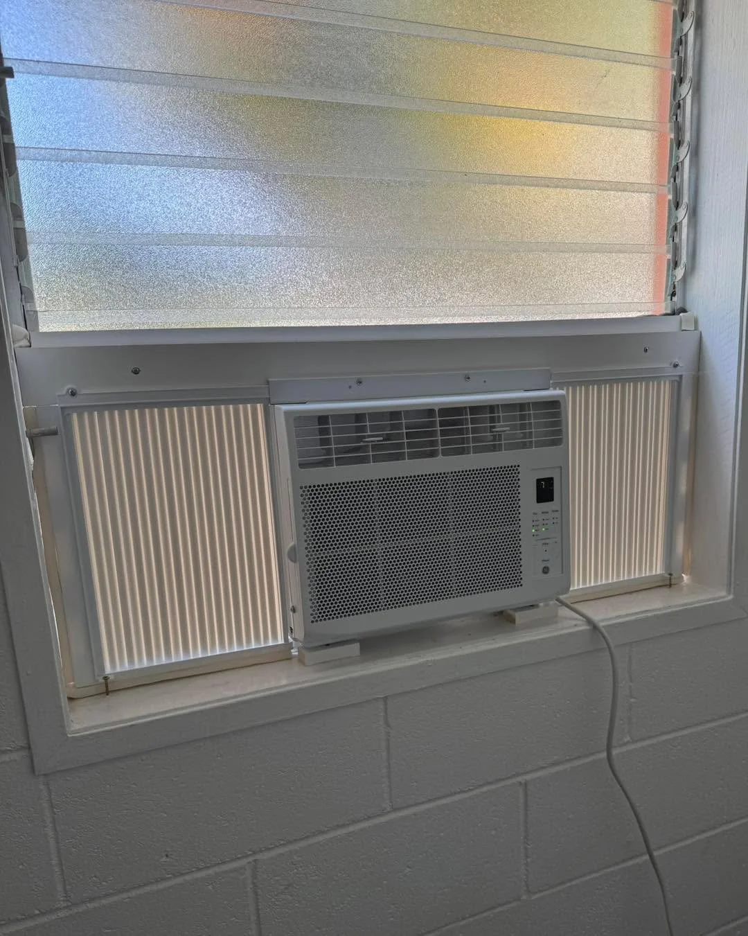 Recent AC installation in a jalousie window