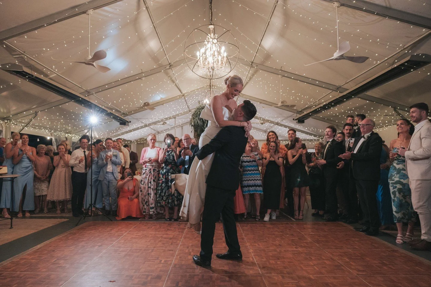 Dancefloors look better when they're full! When you're planning your first dance get all of your guests out of their seats and around the dance floor. It helps frame you two and gives a much better view tot he photos. Plus when your finished the tran
