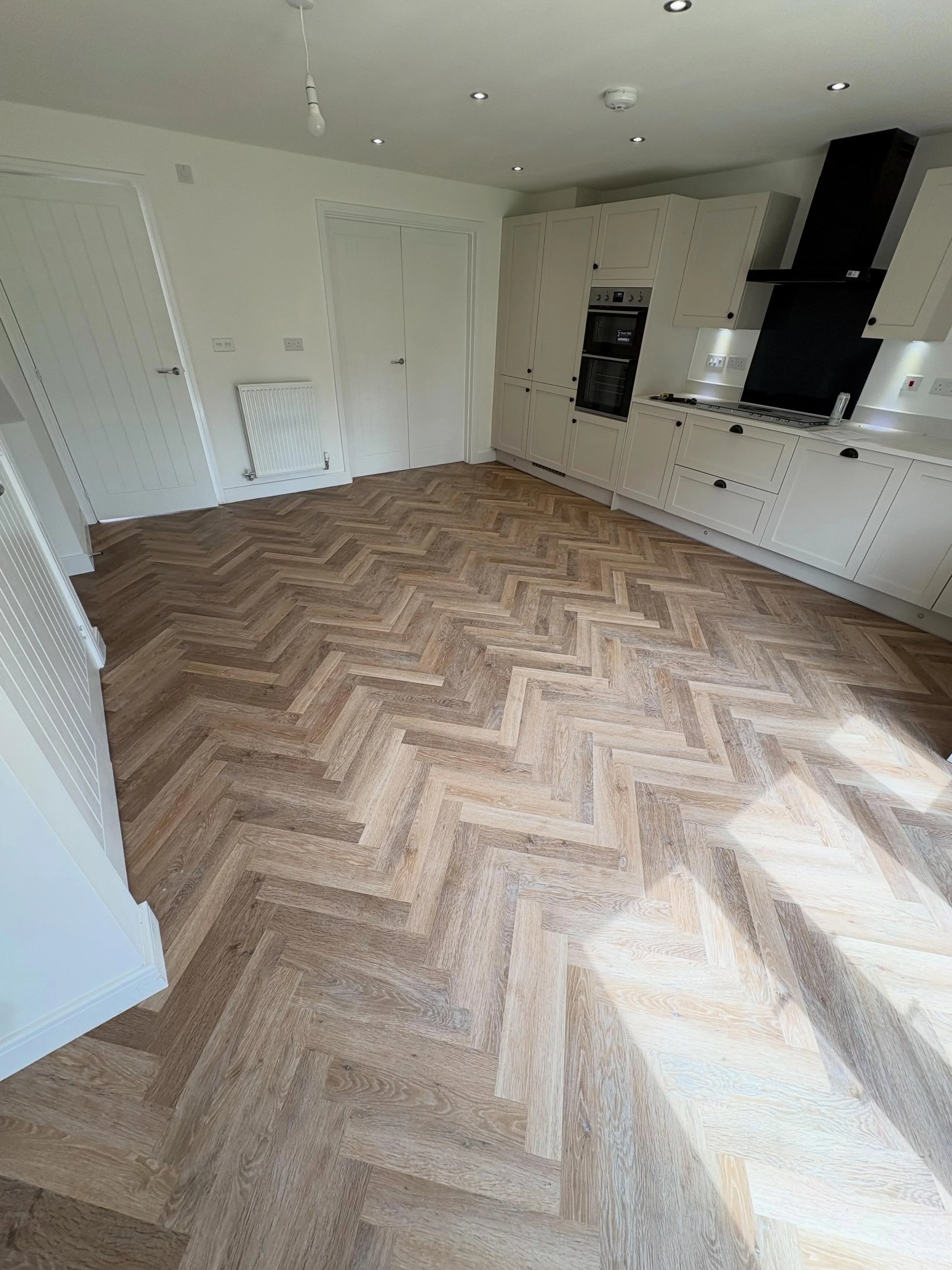 A ground floor LVT herringbone installation completed, this one included the kitchen/dining, hall, and WC. Creating a seamless and elegant finish throughout the home. 

Get in touch for a free quote📥