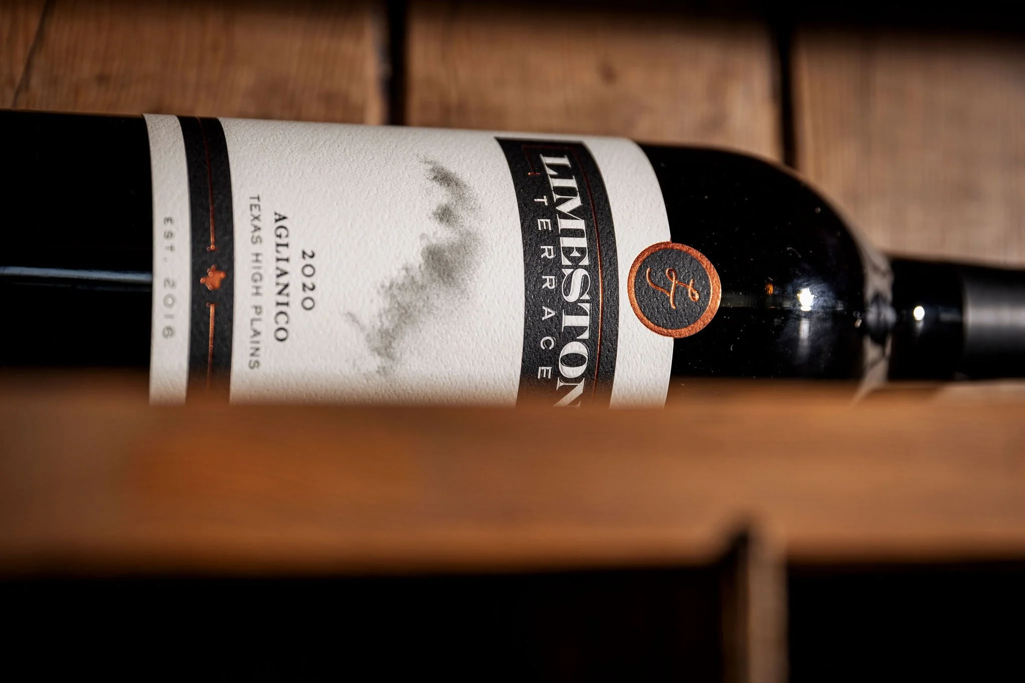 An old-world grape with a Texas attitude. This High Plains Aglianico boldly reimagines an ancient varietal in West Texas' red soils and high elevation. It features black cherry, leather, and dusty earth, reflecting the region's intense sun and cool b