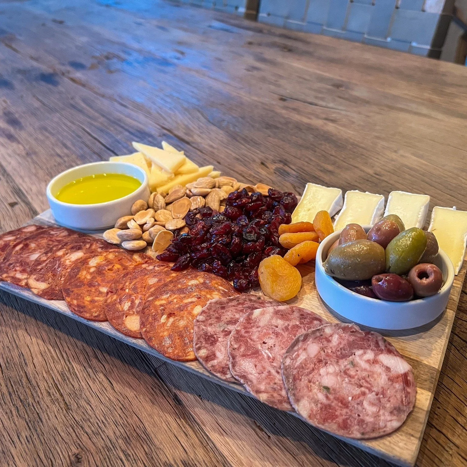 From the best vineyards in Texas to our estate in Italy, quality is always our priority, and it doesn't stop at the wine.
During your next tasting, enjoy a charcuterie board featuring local Texas meats from Texas Iberco, paired with estate olive oil 