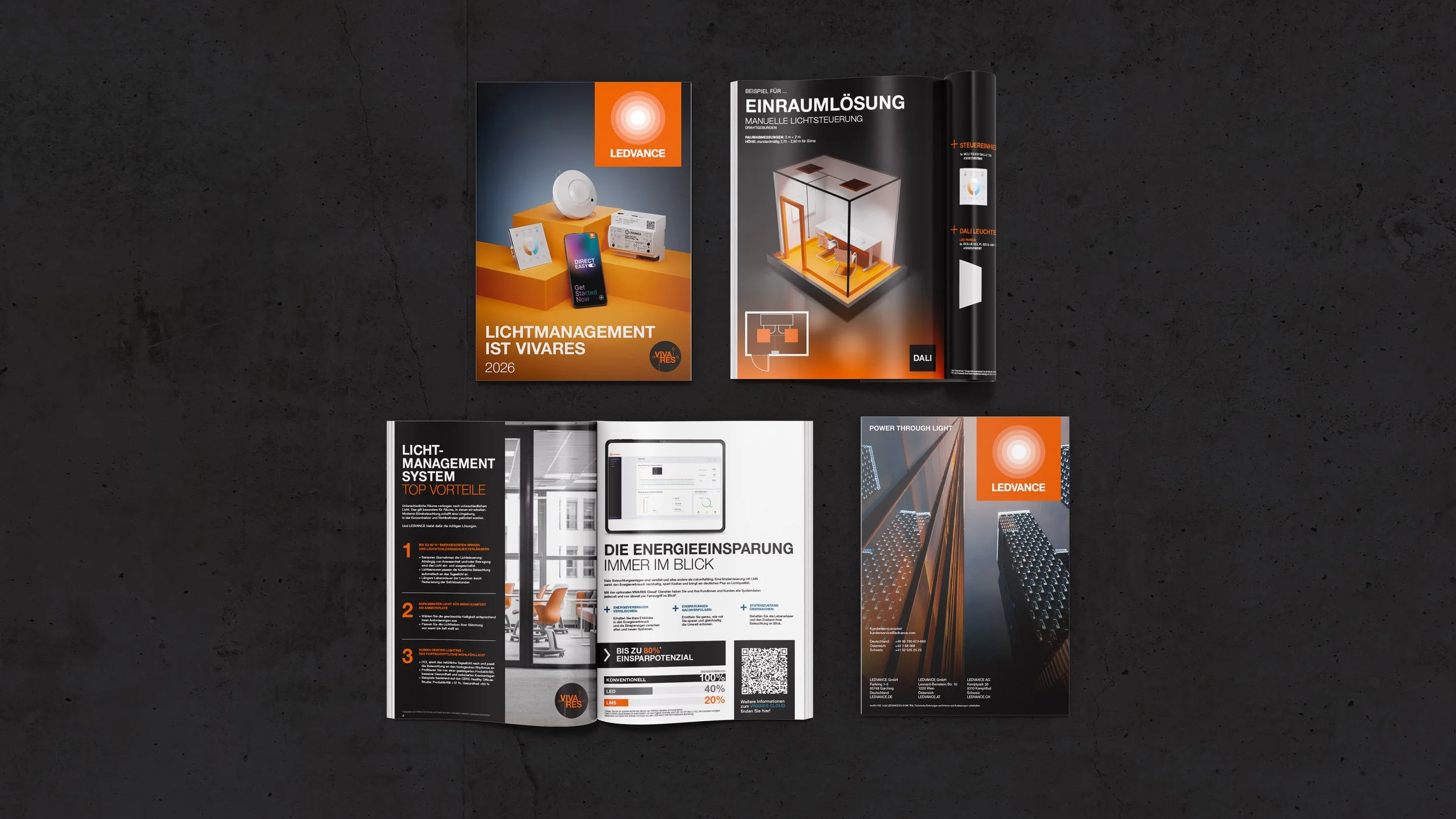 Collection of brochures and flyers related to LED lighting management and energy efficiency on a dark surface.