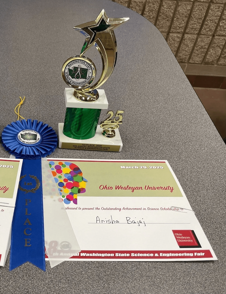 Trophy, ribbon, and scholarship certificate awarded to Anisha Bajaj for her science research at the Washington State Science & Engineering Fair.