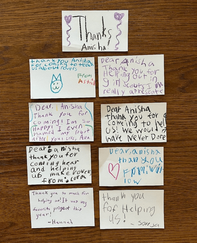 Handwritten thank-you notes from Girl Scout members expressing gratitude after an interactive astronomy outreach session with Anisha Bajaj.