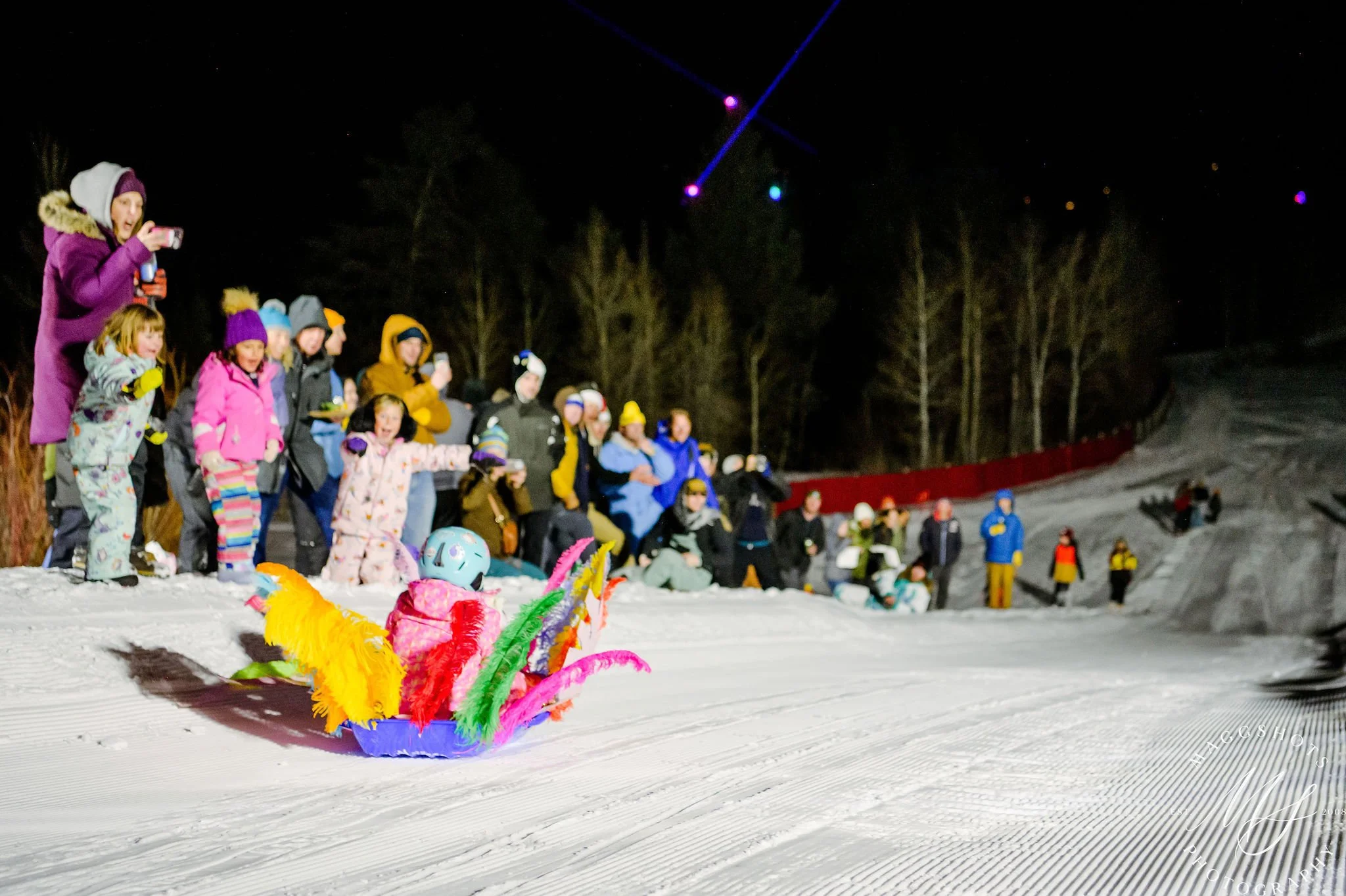 Art Cart race down the ski hill with feathers