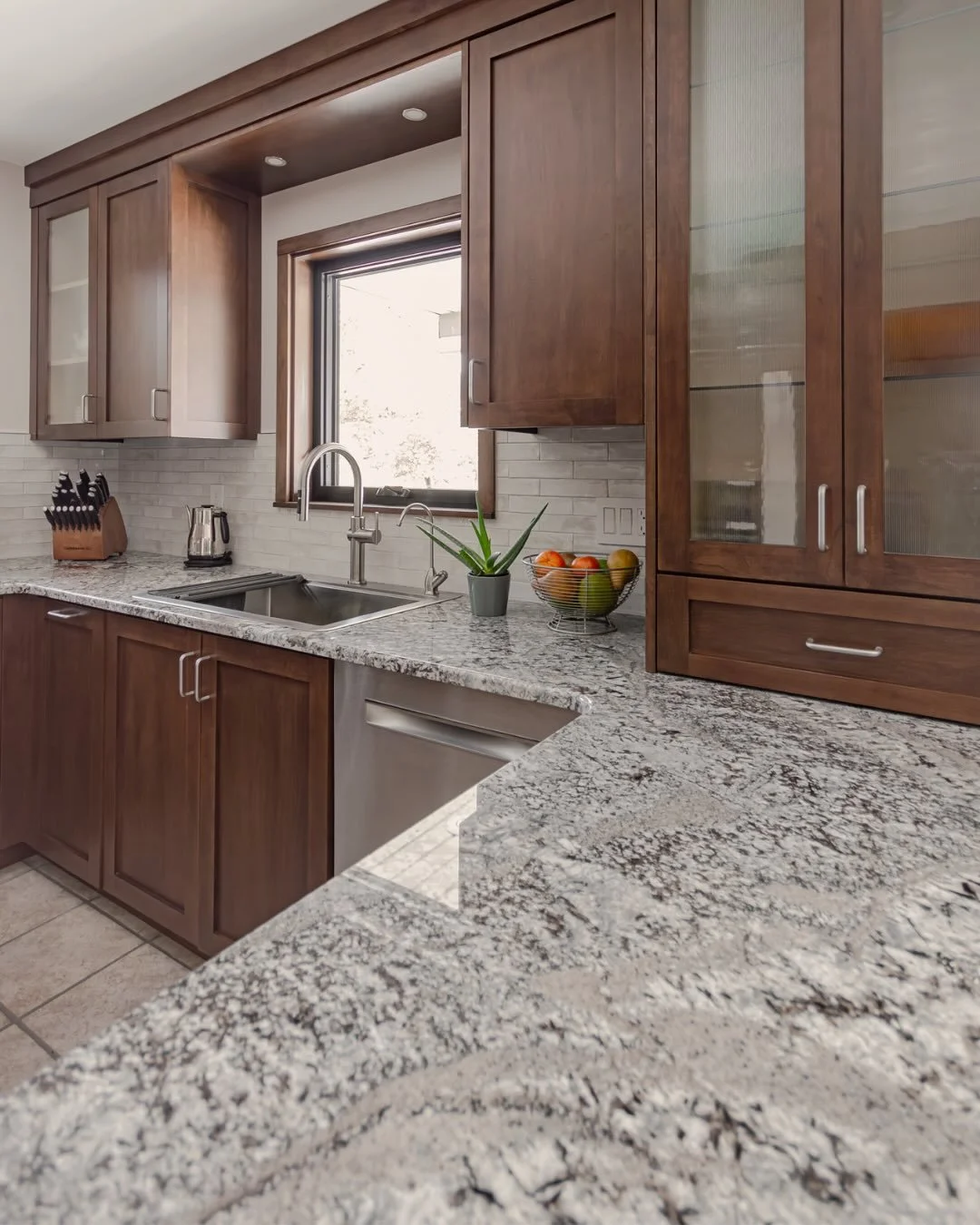 Stone that brings the whole space together.⁠
⁠
From the kitchen and island to the pantry and bathroom vanity, this project features beautiful stone surfaces that add movement, durability, and timeless style.⁠
⁠
📍 Countertops by Graniteworx⁠
⁠
Millwo