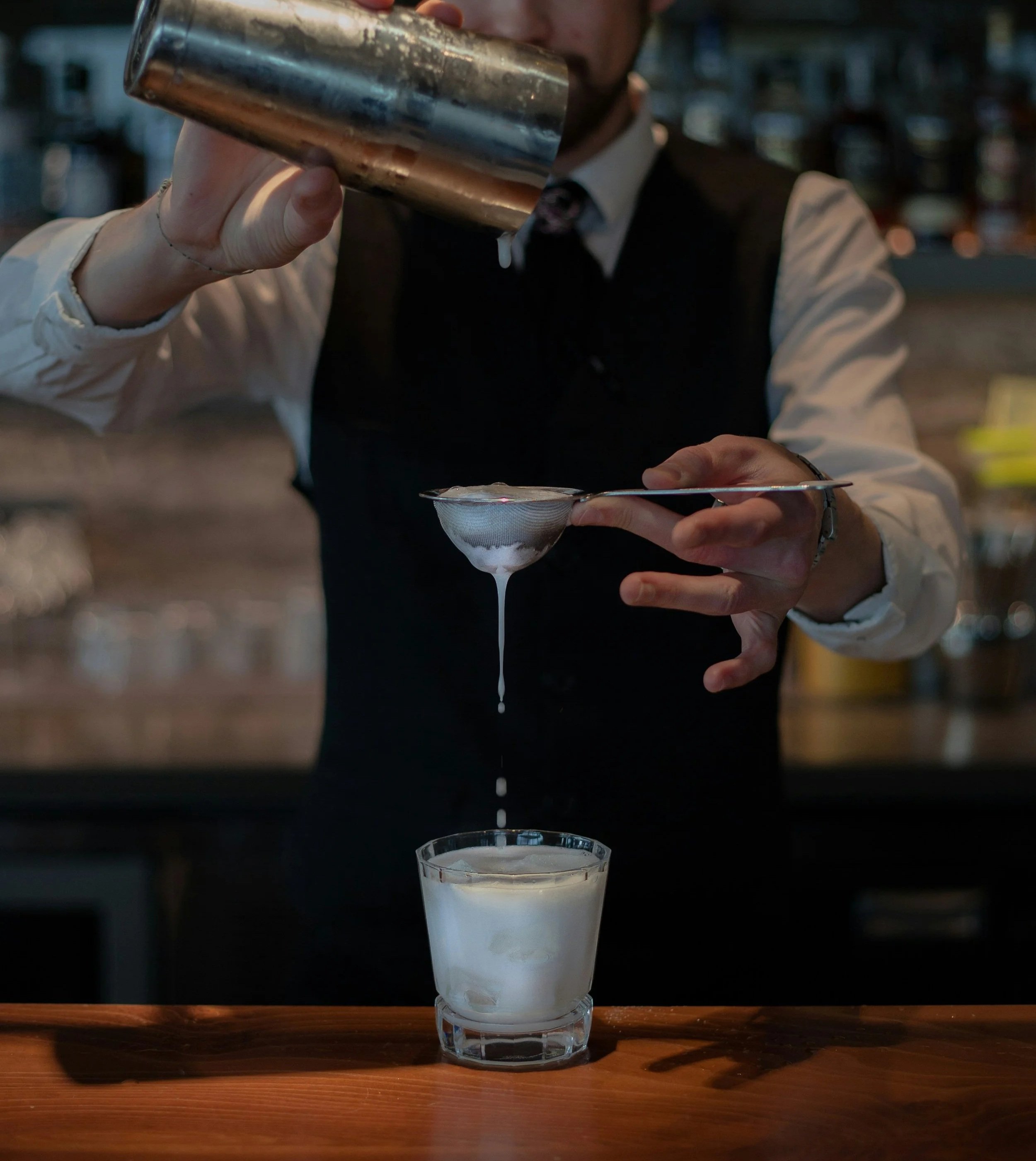 Bartender Making a P.S. I Love You, a creamy indulgent cocktail inspired by romantic evenings