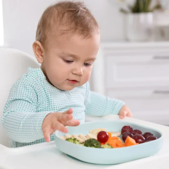 Baby_Eating_Solid_Foods.webp