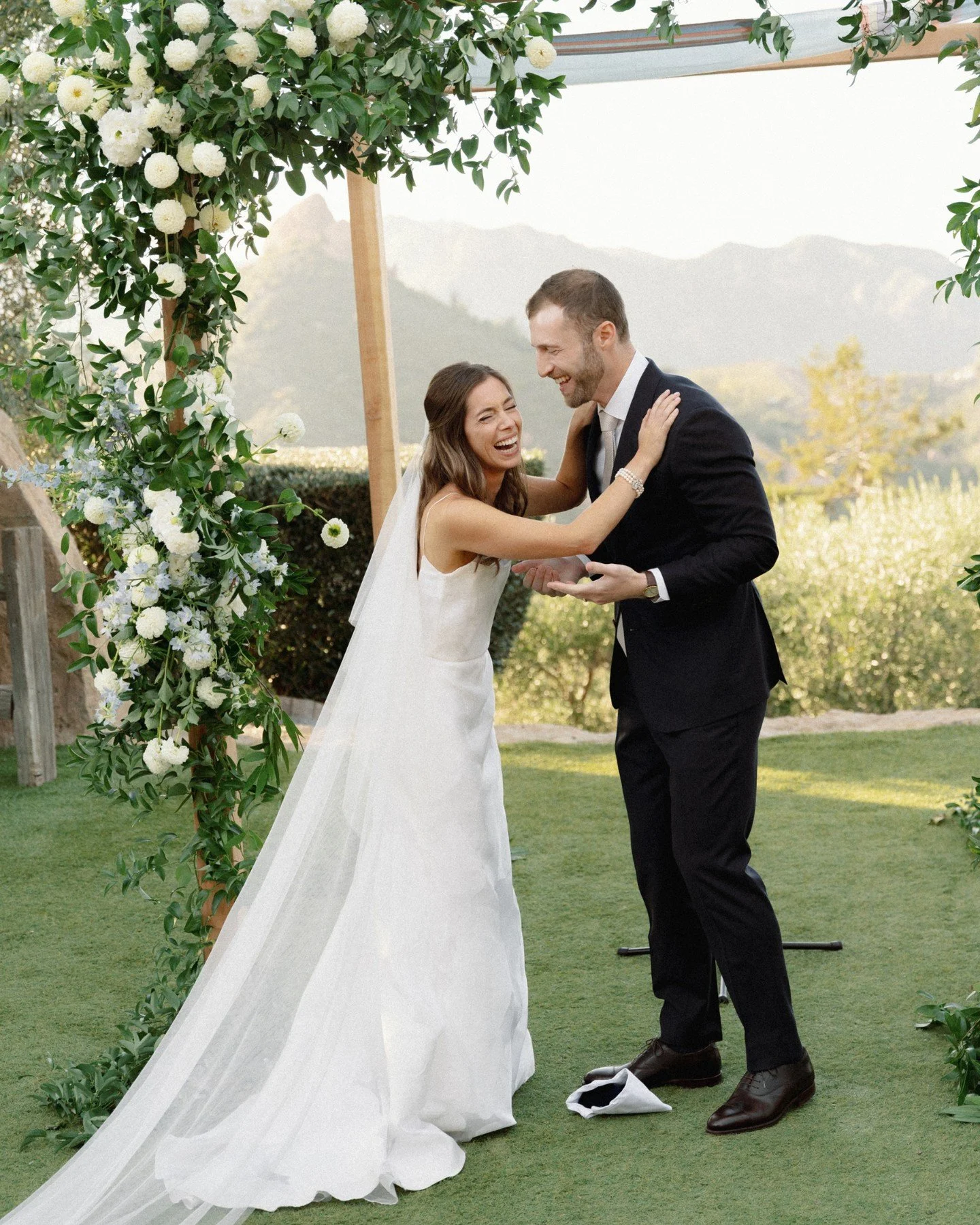 More giggles in the greenery. A fantastic ceremony full of laughter, friendship, stories and joy. Thank you Matt &amp; Olivia for having me capture your gorgeous day at Cielo Farms.