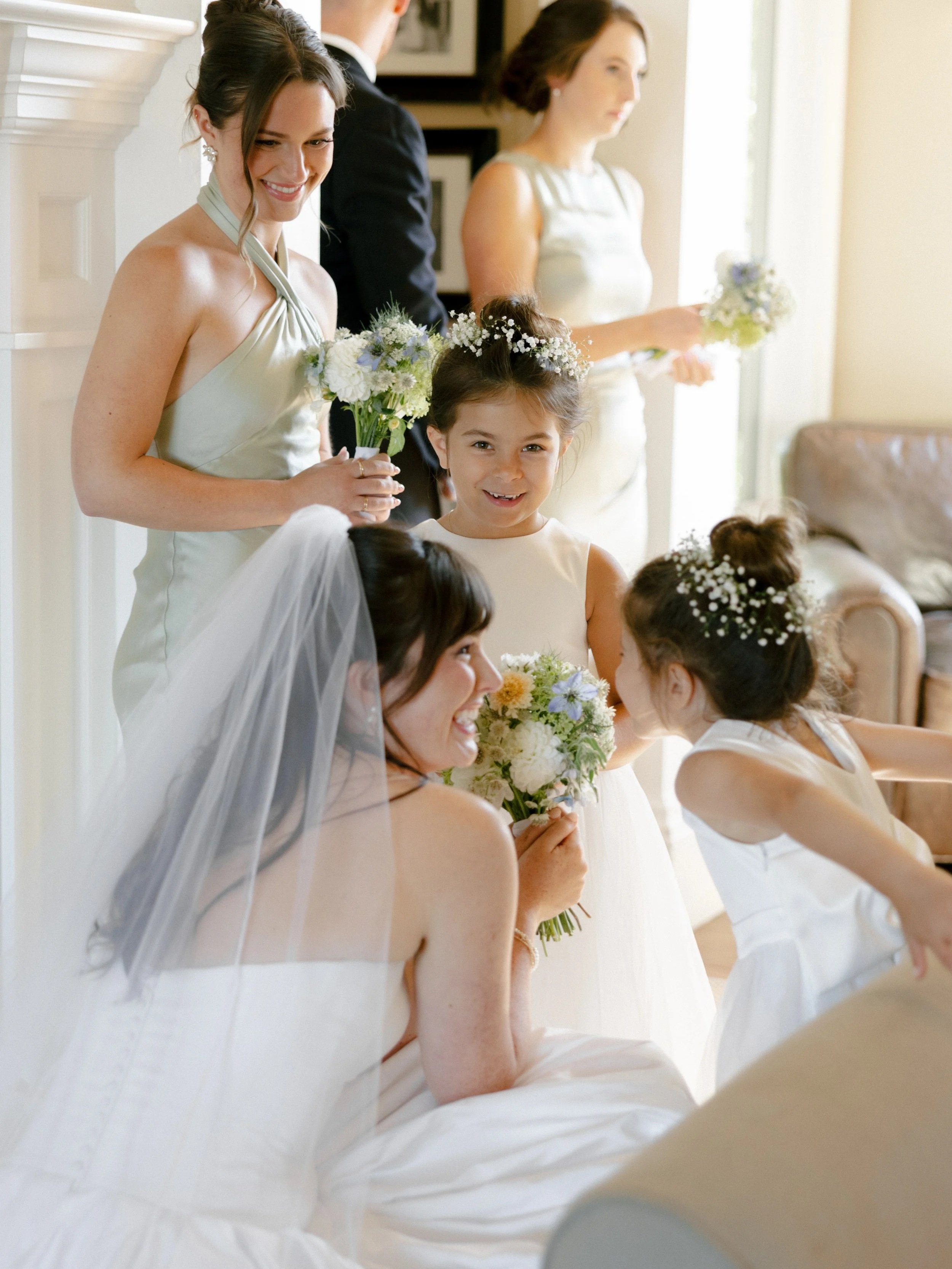 Top Ojai wedding photographer Katie Edwards captures bride with flower girls right before walking down the aisle. Film photographer in Santa Barbara was able to capture the essence of the sweetness of the flower girls.