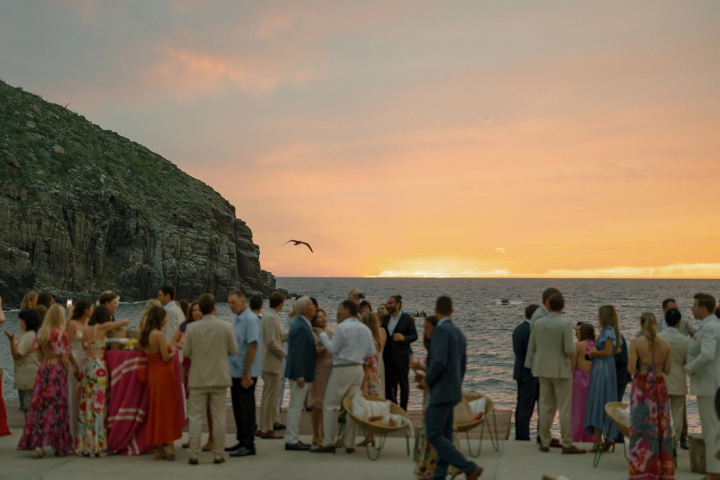 San Cristobal wedding inspiration.  Todos Santos wedding at San Cristobal Hotel captured by Katie Edwards. Guests are enjoying sunset cocktail hour in Mexico captured by the best wedding photographer in California, Katie Edwards
