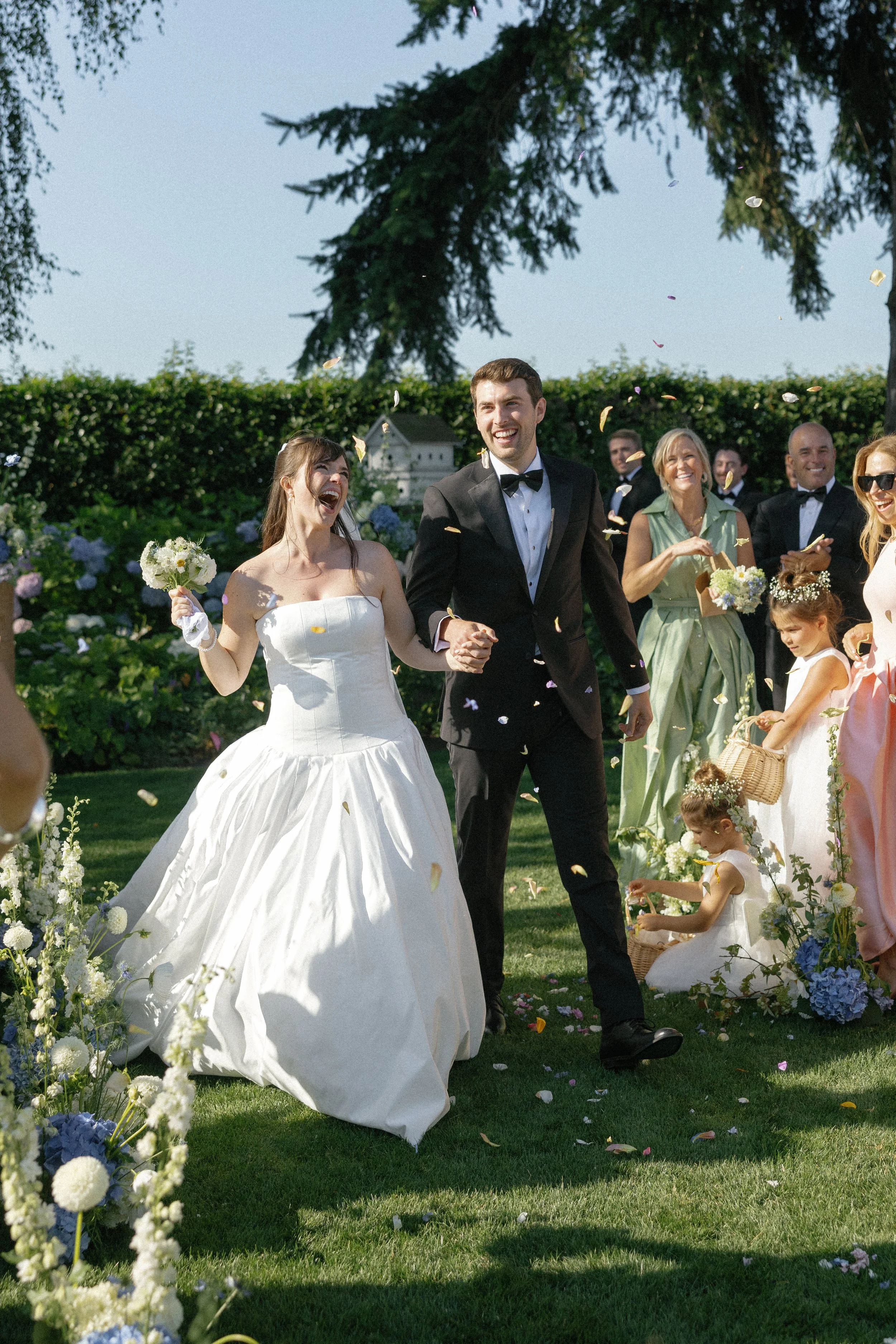 Ojai wedding photographer Katie Edwards captured Seattle couple walking down the aisle in celebration.