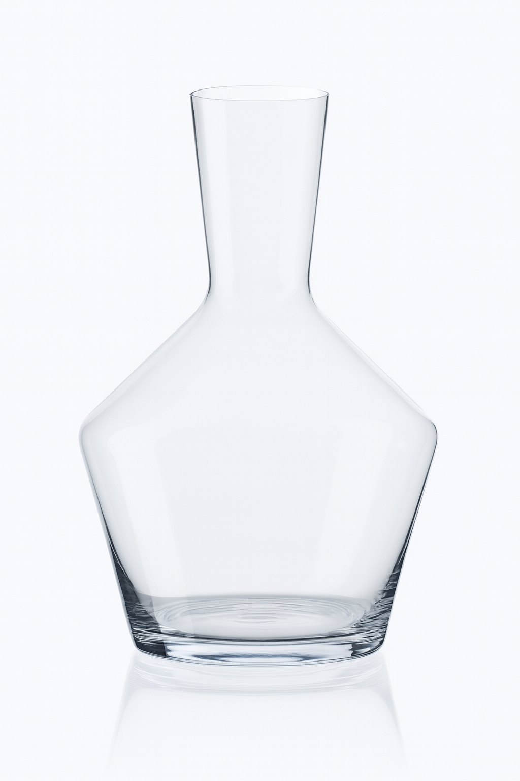 Clear glass decanter with a geometric shape on a white background.