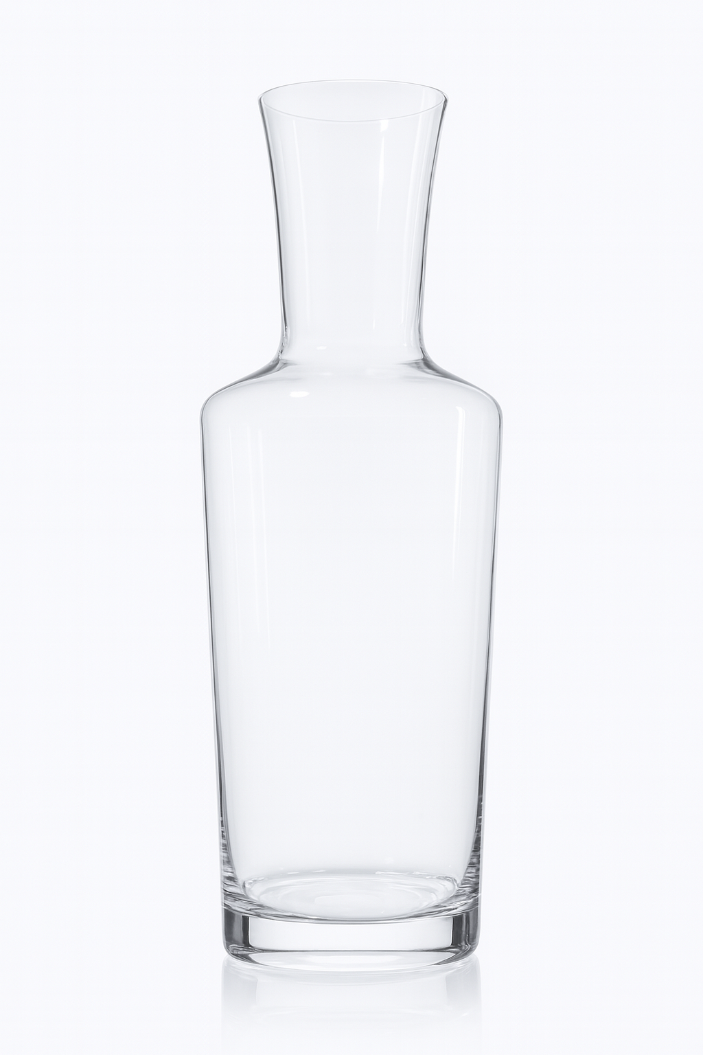 Empty clear glass decanter with a wide base and narrow neck on a white background.
