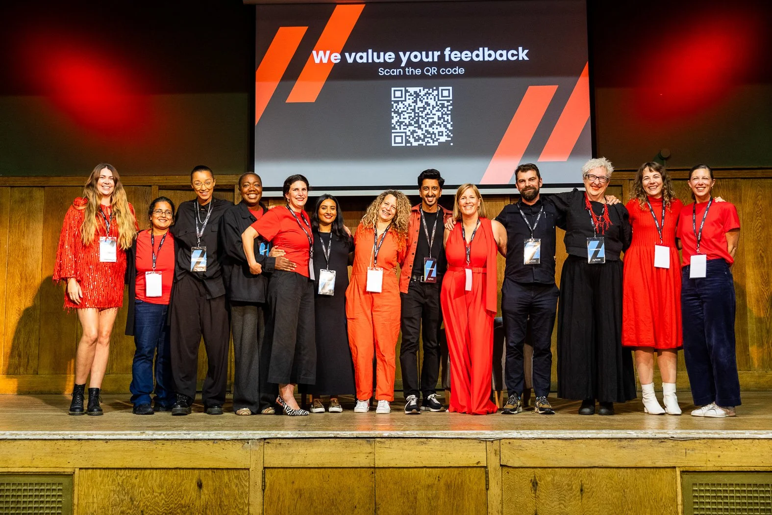 The committee on stage at the end of the day, dressed in UN//SCENE colours of red and black and cheering to a brilliant line up of speakers and a wondeful audience.