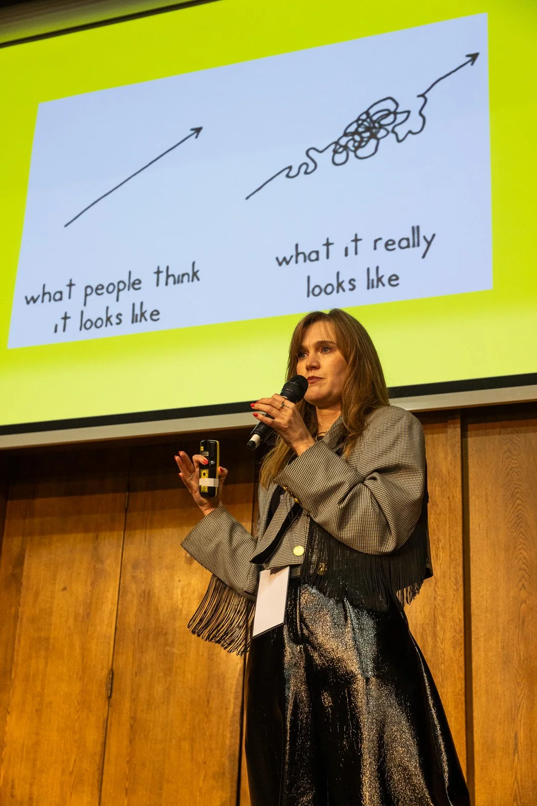 Sarah Booth on the main stage giving her speech on greenwashing,