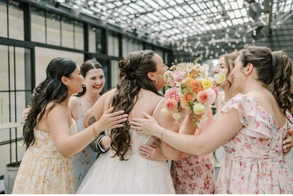 A Pennsylvania bride with a half up bun with loose waves
