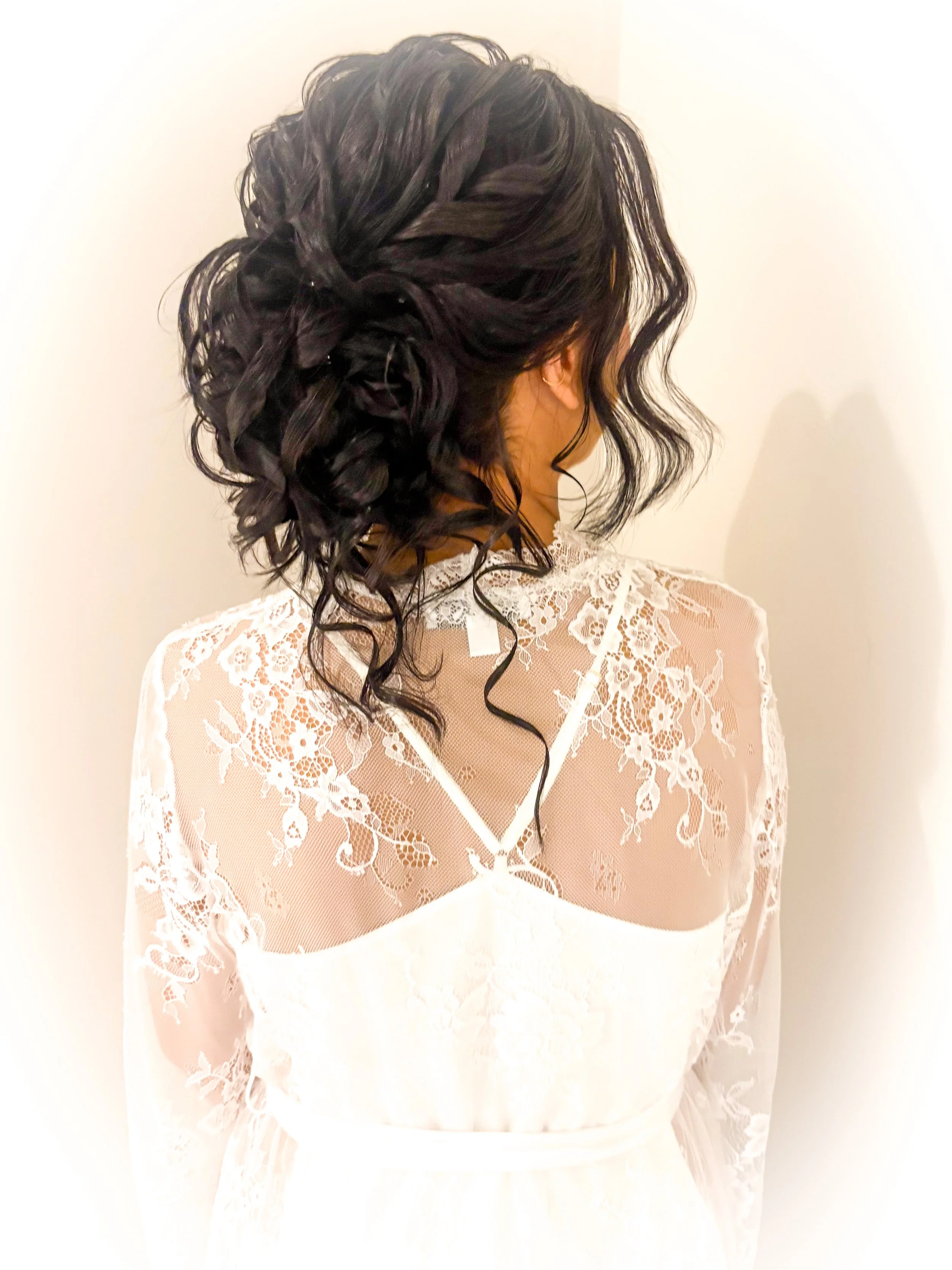 A Renault winery bride with a romantic low textured soft bun