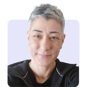 Casual woman with short gray hair making a playful facial expression