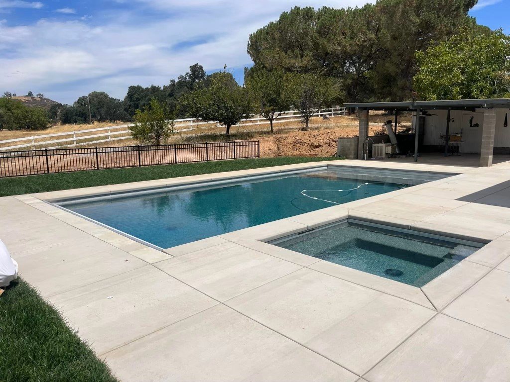inground pool with jacuzzi