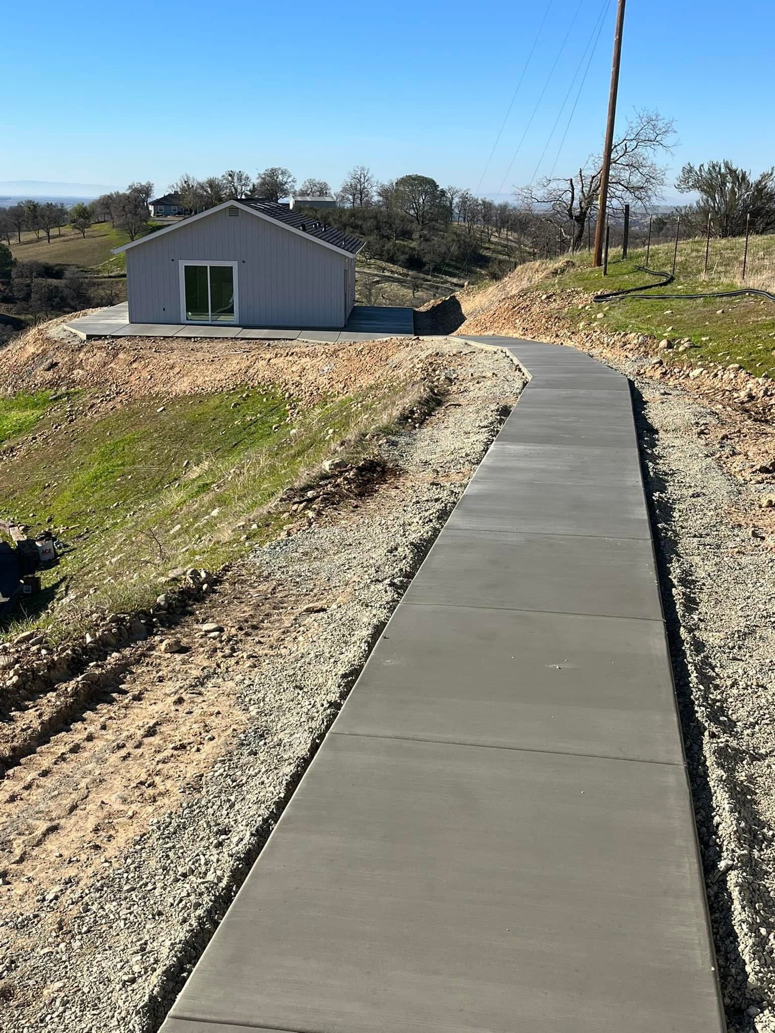 Concrete sidewalk leading to an ADU