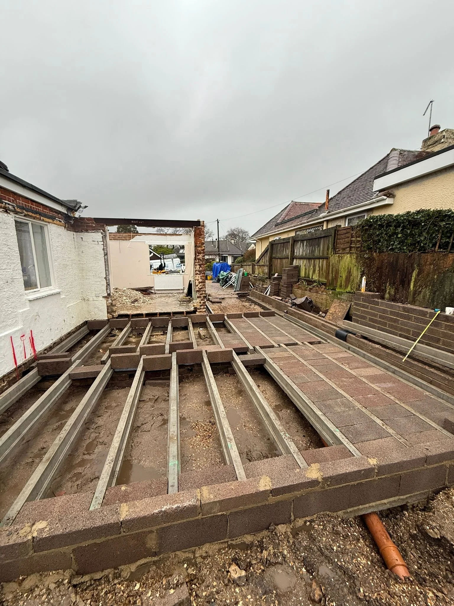 Progress view of block and beam floor on bungalow