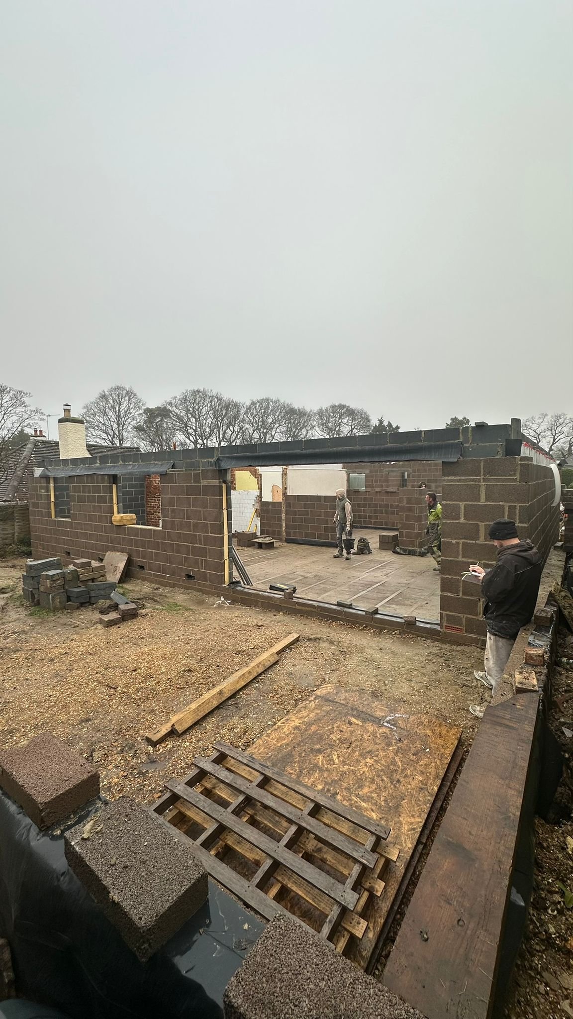 Rear view of bungalow during construction in Highcliffe