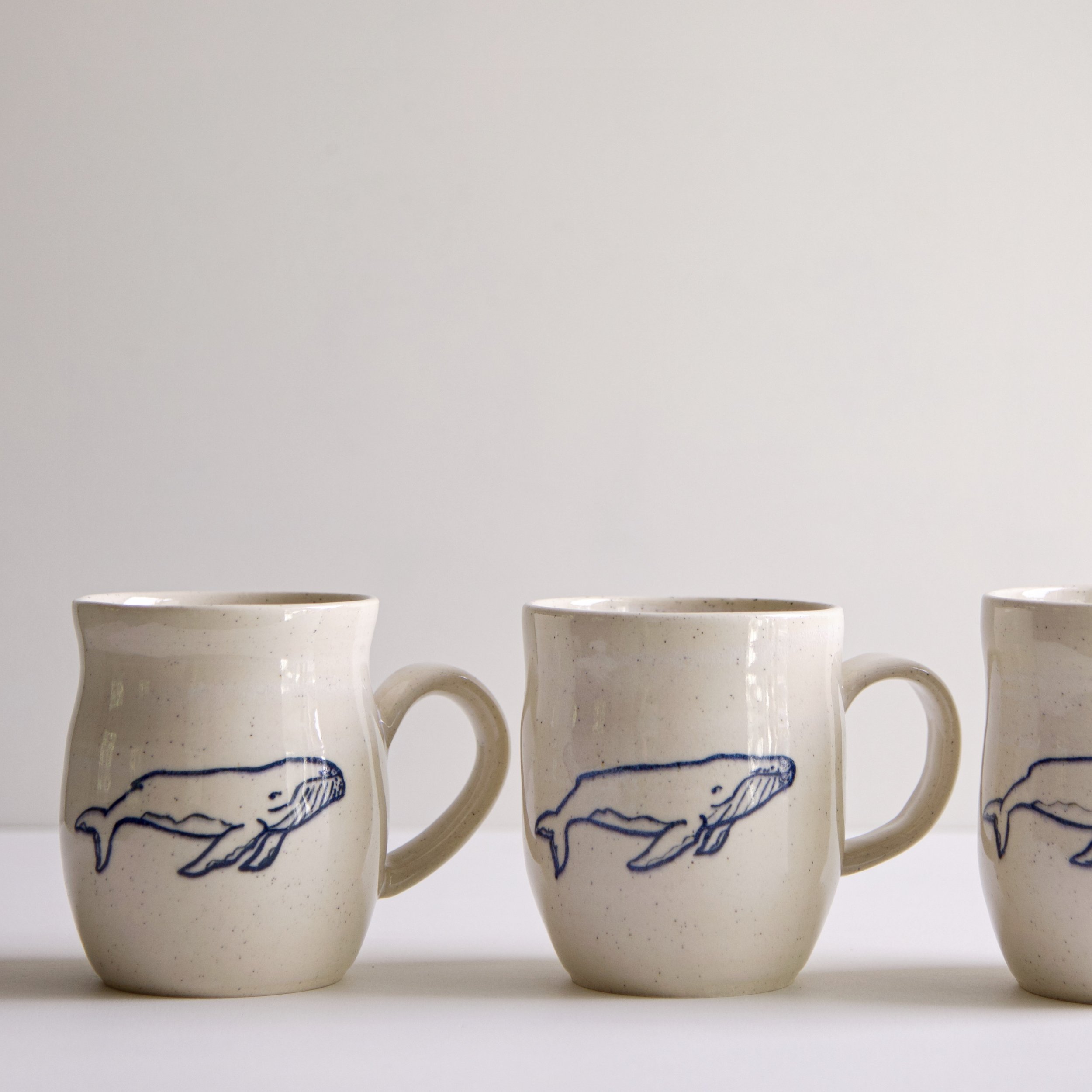 My next batch of mugs, medium cups, small cups, and vases. 
This time I went with a curvier shape.