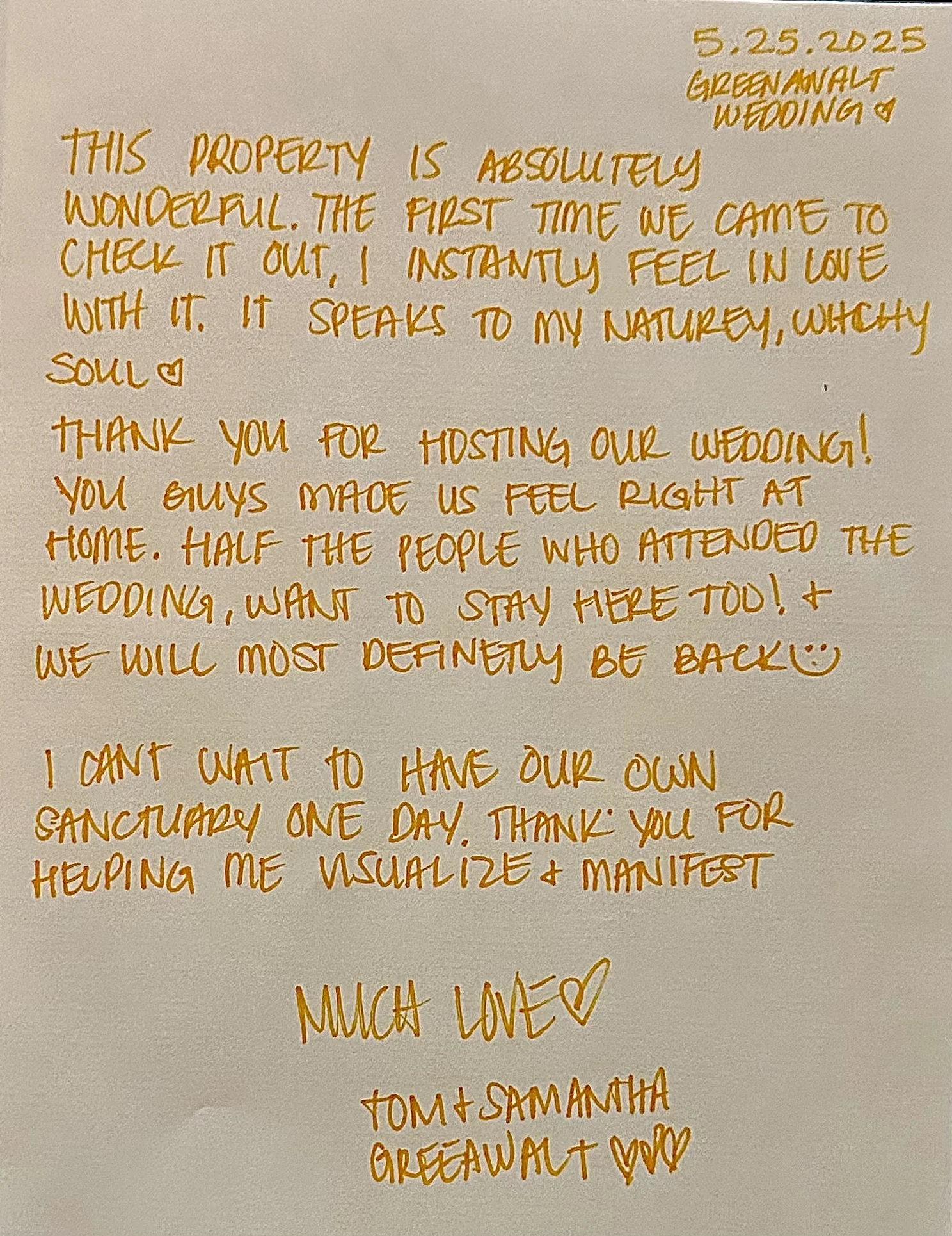 A handwritten note on a white sheet of paper with gold ink. The note is dated 5.25.2025 and mentions a wedding written as 'Greewalt Wedding.' The message expresses gratitude for hosting a wedding and describes feelings of love and appreciation. It also talks about future plans to have their own sanctuary and ends with love from Tom and Samantha.