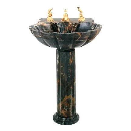 Marble fountain with gold sculptures on top