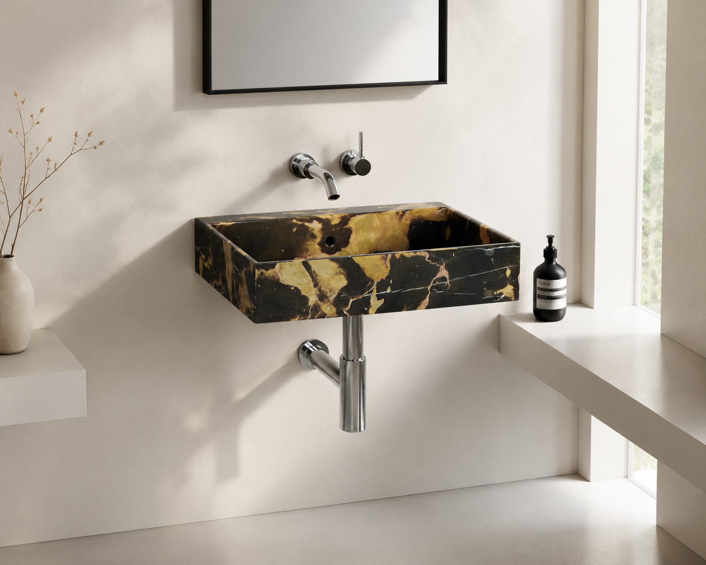 A minimalist bathroom with a black and gold marble rectangular sink, a wall-mounted faucet, and a small black soap dispenser on a white ledge by a window.