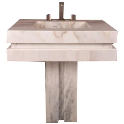 Marble bathroom sink with a soap dispenser and faucet.