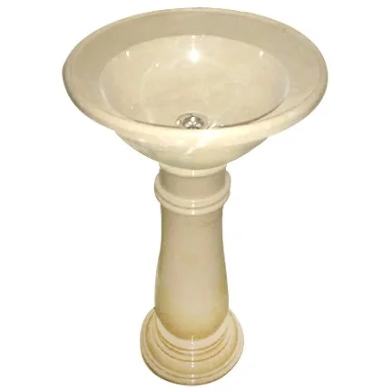 A white pedestal sink with a round basin.