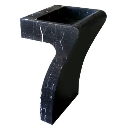 Black stone pedestal with white veining, designed for holding a plant or decorative item.
